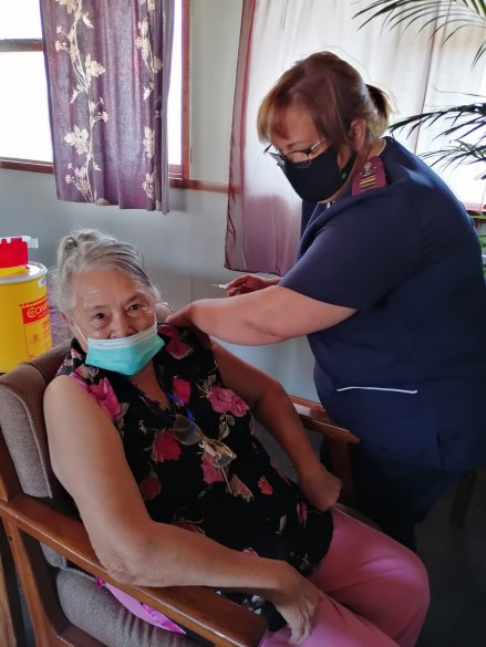 Ms Hazel Malherbe (72) receiving her booster vaccination.jpeg